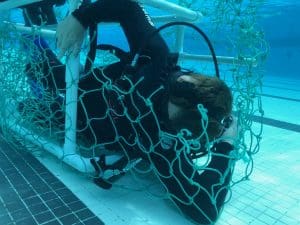 dive rescue international class - man tangled in ropes underwater